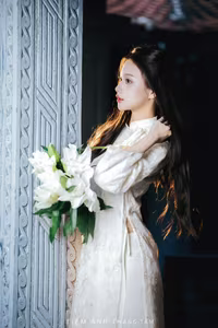 VGU No.131: Explore the Ethereal Beauty of a Vietnamese Lady in White Ao Dai with Lilies-11