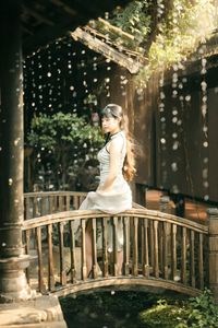 Elegant Vietnamese Girl on Ancient Wooden Bridge-5