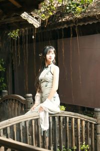 Elegant Vietnamese Girl on Ancient Wooden Bridge-6