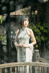 Elegant Vietnamese Girl on Ancient Wooden Bridge-3