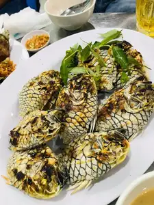 Mekong Delta's Humble Fish: Transformed into an Exquisite Grilled Delicacy for Food Lovers.-0