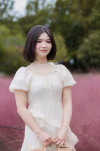 XVG No.33: Ethereal Beauty in White Dress Amidst Dreamy Pink Grass Field - A Serene Nature Escape-8