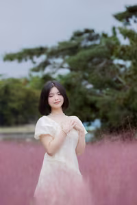 XVG No.33: Ethereal Beauty in White Dress Amidst Dreamy Pink Grass Field - A Serene Nature Escape-9