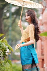 Traditional Vietnamese Beauty: Elegant Lady with Golden Lotus-12