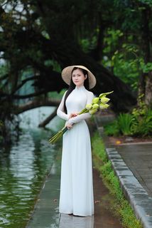 Vietnamese Ao Dai Beauty: Elegant Young Woman by Hoan Kiem Lake, Traditional Charm.-8