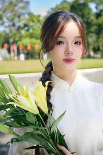 Youthful Vietnamese Girl in Pure White Silk Ao Dai with Yellow Lilies-9