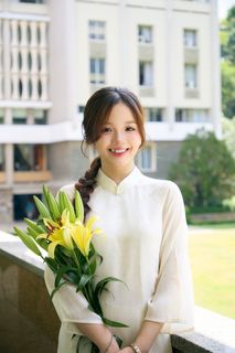 Youthful Vietnamese Girl in Pure White Silk Ao Dai with Yellow Lilies-1