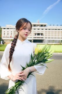 Youthful Vietnamese Girl in Pure White Silk Ao Dai with Yellow Lilies-6