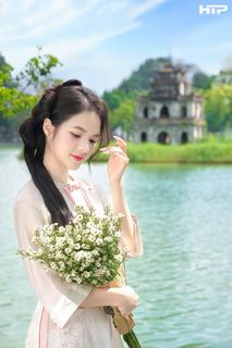 Gentle Beauty of Vietnamese Woman in Traditional Ao Dai at Hoan Kiem Lake-7
