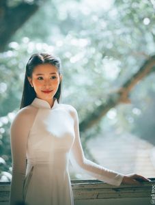 Graceful Vietnamese Girl in White Ao Dai by Window, Celebrating Traditional Beauty-14
