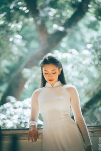 Graceful Vietnamese Girl in White Ao Dai by Window, Celebrating Traditional Beauty-10