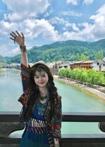 Discover Fenghuang Ancient Town: Serene boat ride, historic riverside charm.-1