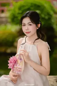 Graceful Young Woman in a Dreamy Garden: A Serene and Elegant Moment 1000025211-0