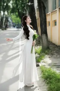 Vietnamese Schoolgirl Gracefully in Pure White Ao Dai Traditional Conical Hat and Lilies-4