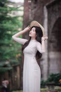 XVG No.45: Captivating Grace: Vietnamese Girl in White Ao Dai, Embracing Youthful Elegance-0