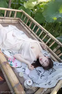 Discover Lu Xuan Xuan's Graceful Beauty in a White Dress Amidst a Serene Lotus Pond - XiuRen No.10630-27