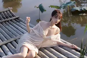 Discover Lu Xuan Xuan's Graceful Beauty in a White Dress Amidst a Serene Lotus Pond - XiuRen No.10630-40