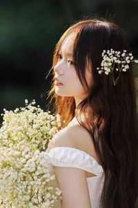 Captivating Portrait: Gentle Girl's Natural Beauty with Pure White Flowers in Golden Sunlight. Discover Her Grace.-5