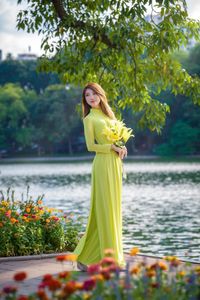 Serene Vietnamese Beauty: Woman in Ao Dai by the Lake-15