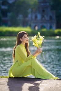 Serene Vietnamese Beauty: Woman in Ao Dai by the Lake-16