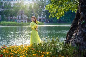 Serene Vietnamese Beauty: Woman in Ao Dai by the Lake-12