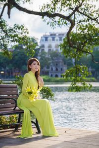 Serene Vietnamese Beauty: Woman in Ao Dai by the Lake-13