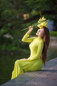 Serene Vietnamese Beauty: Woman in Ao Dai by the Lake-0