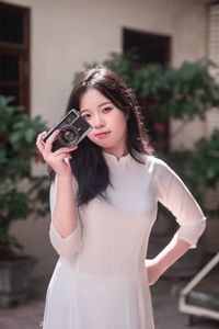 White Ao Dai Beauty: Vietnamese Girl with Vintage Camera-3