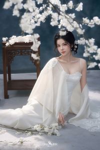 Discover Ethereal Grace: An Asian Beauty in Pure White Amidst Delicate White Blossoms-3