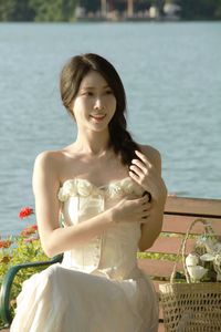 Elegant Beauty of a Girl by the Lake in Serene Natural Scenery-1