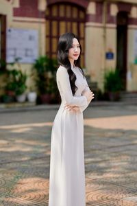 Captivating White Ao Dai: Elegant Vietnamese Girl in a Serene Moment, Timeless Beauty. Image ID: 1000019816.-7