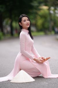 Pink Ao Dai Grace: Vietnamese Beauty with Elegant Girl and Traditional Conical Hat-1