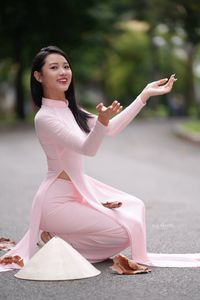 Pink Ao Dai Grace: Vietnamese Beauty with Elegant Girl and Traditional Conical Hat-3