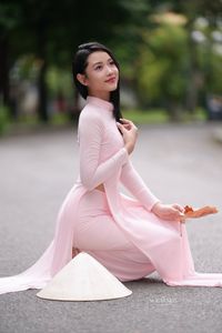 Pink Ao Dai Grace: Vietnamese Beauty with Elegant Girl and Traditional Conical Hat-7