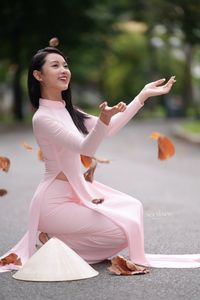 Pink Ao Dai Grace: Vietnamese Beauty with Elegant Girl and Traditional Conical Hat-6