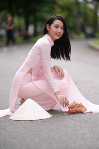 Pink Ao Dai Grace: Vietnamese Beauty with Elegant Girl and Traditional Conical Hat-0