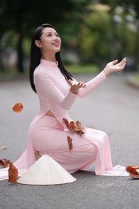 Pink Ao Dai Grace: Vietnamese Beauty with Elegant Girl and Traditional Conical Hat-10