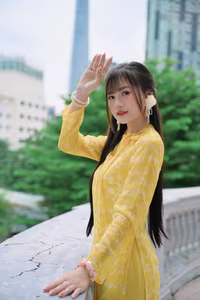 VGU No.105: Vietnamese Girl in Yellow Áo Dài Shines in Modern City – Captivating Beauty-0