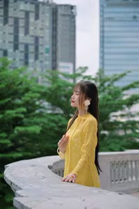 VGU No.105: Vietnamese Girl in Yellow Áo Dài Shines in Modern City – Captivating Beauty-6